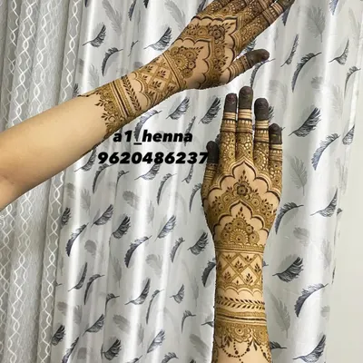 A beautiful semi-bridal or party design that covers the back of the hand and wrist with architectural and floral elements.