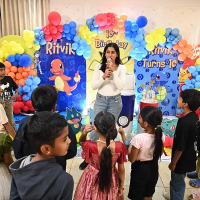 This is my happy place, right in the middle of the fun at a kids' birthday party. I was getting the kids ready for a game at this Pokémon themed celebration, making sure everyone felt like part of the adventure.