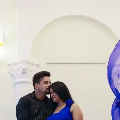A happy client moment from a maternity shoot. The classic white moulded wall provides a clean and elegant backdrop for capturing the love and anticipation of this special time.