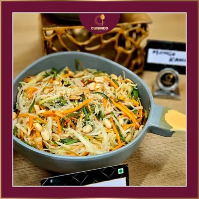 A close-up of my raw papaya and peanut salad. This dish is a perfect example of my focus on fresh ingredients and balanced flavors. It's a light, healthy, and visually appealing option for any gathering.