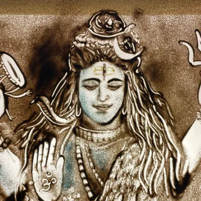 A detailed sand portrait of Lord Shiva for Mahashivratri, showing him with his damru and trishul. I love using colored sand to add vibrancy and a divine feel to these cultural illustrations.
