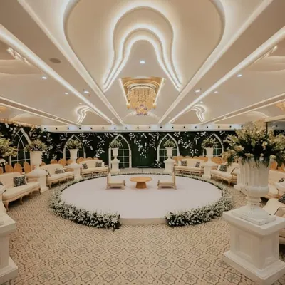 This stunning white-themed engagement ceremony decor radiates subtle chicness. The circular stage and surrounding lounge seating create an intimate and magical ambiance for a timeless celebration.