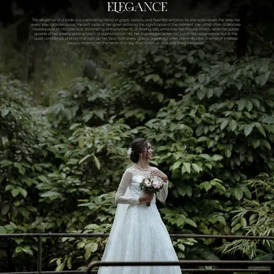 A breathtaking wide shot of a Christian bride in her elegant white gown, standing on a balcony surrounded by lush greenery. A perfect bridal portrait.