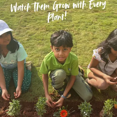 There's no better way for children to learn about nature than by getting their hands in the soil. Here, I'm guiding young gardeners as they plant flowers, teaching them about growth and responsibility in a fun, hands-on way.