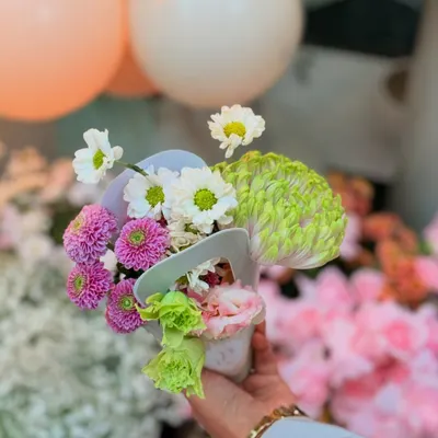 A beautiful hand-held posy of fresh flowers, showcasing the delicate floral work that I incorporate into my events.