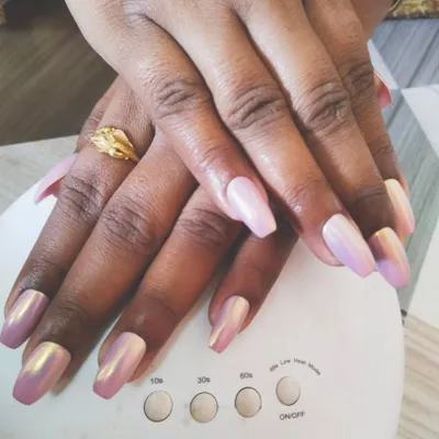 You can never go wrong with a beautiful chrome finish. Here, I've applied a stunning iridescent pink chrome powder over coffin-shaped gel extensions. The way it catches the light is just amazing, and it’s all cured perfectly under my portable UV lamp.