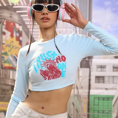 Capturing the energy of Tokyo streets for this K-pop inspired shoot. I styled a graphic crop top with white sunglasses and pastel headphones to create a look that's playful and perfect for a youth-focused fashion brand.