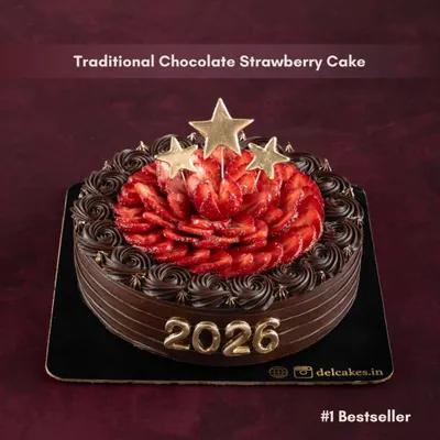 Our number one bestseller for the New Year, the Traditional Chocolate Strawberry Cake. It's decorated with fresh strawberries, gold star toppers, and the year '2026' to ring in the celebrations.