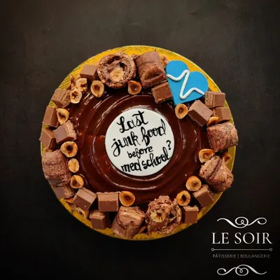 Go big or go home with my giant doughnut cake. It's a 7-inch baked doughnut covered in chocolate and loaded with treats like hazelnuts and Kinder Bueno, perfect for a party.