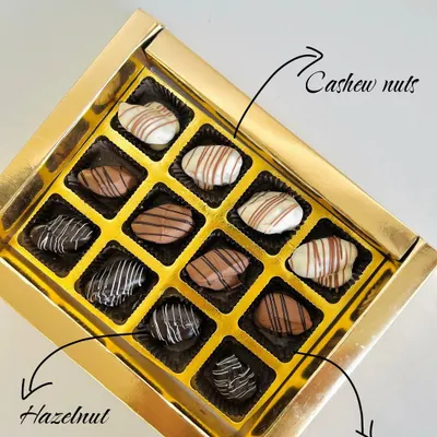 A closer look inside my assorted Diwali chocolate box. This one features three delicious varieties: creamy cashew, rich hazelnut, and a sweet and salty salted almond.