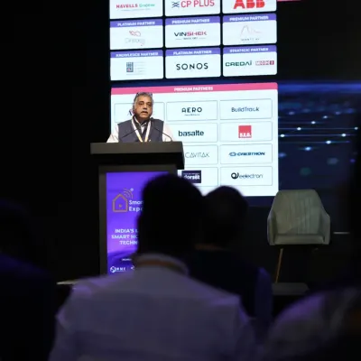 A keynote speaker addresses the audience at the start of the conference and awards ceremony, with our valued partners displayed prominently on screen.
