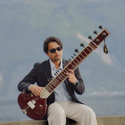 A playful moment in Lausanne, Switzerland, inspired by the "Peaky Blinders" style. It shows my contemporary side and the joy I find in blending tradition with modern aesthetics, whether in music or in life.