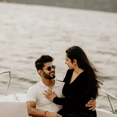 A candid moment on a speedboat, with the wind in her hair as they share a loving look.
