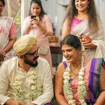 A candid moment from my wedding day. I styled myself in a beautiful pink and purple saree that felt both traditional and personal. I work with clients to achieve this same balance for their big day, ensuring every detail, from the saree to the accessories, reflects their personality.