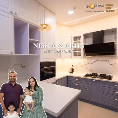 We designed this beautiful grey and off-white kitchen for Nisha and Arun's family. It features an island for extra prep space, sleek handleless cabinets, and under-cabinet lighting for a bright and functional cooking environment.