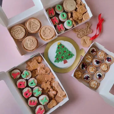 My complete Christmas collection for a very doggo Christmas. This spread shows the variety I offer, including themed cupcakes, pies, tarts, and a celebration cake.