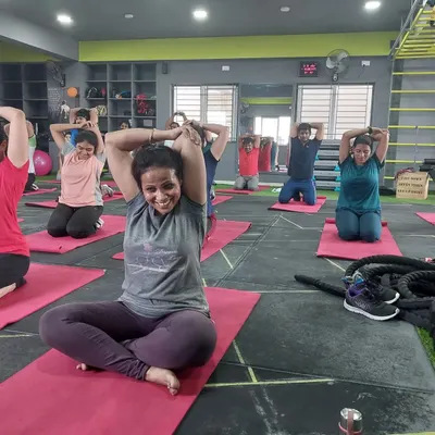 Cooling down with some essential stretches after an intense aerobics session. This tricep stretch helps with upper body flexibility and muscle recovery.