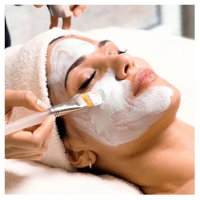 Relax and rejuvenate with one of our custom facials. Here, a client is enjoying a nourishing face mask application, a key step in our treatments for glowing skin.