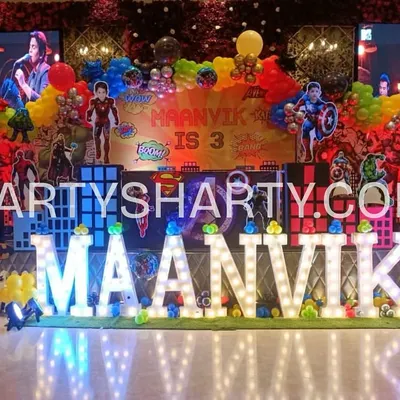 We assemble the mightiest heroes for an epic birthday bash. This Avengers stage is packed with action, featuring multiple character cutouts, city-scape backdrops, and vibrant marquee letters that put the birthday boy's name in the spotlight.