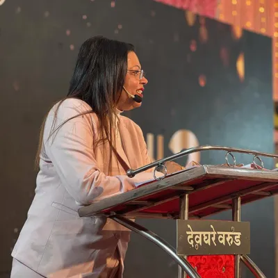 A candid moment from one of my speaking engagements. I find great joy in sharing my journey and expertise from the podium, connecting with the audience on a personal level.