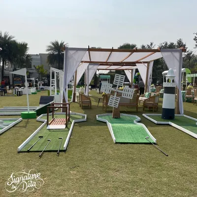 For a sports-themed party, I set up a complete mini-golf course on the lawn. Each hole had fun obstacles, like a windmill and a lighthouse, providing a great activity for kids and adults alike.