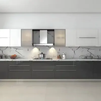A sleek, ultra-modern straight kitchen with dark grey base cabinets and white uppers. The striking marble-patterned backsplash serves as a dramatic feature wall, elevating the entire design.