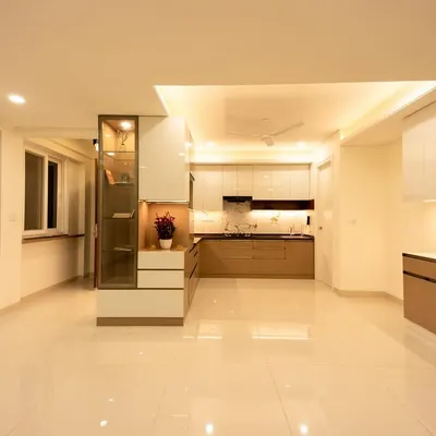 A look inside Bhavinee's home, where we created an open and airy living space. The design features neutral tones, ample storage, and beautiful display cabinets.