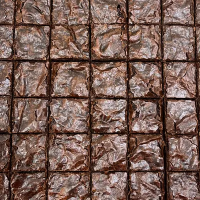 Look at that perfect crinkly top. Our brownies are incredibly fudgy and gooey, and they're made without any eggs or refined sugar.
