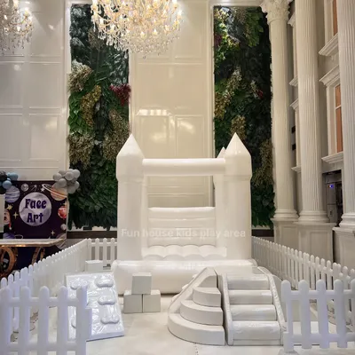 Our all-white bouncy castle and soft play climbers set up indoors. The clean, modern look complements any upscale event decor while providing a dedicated fun zone.