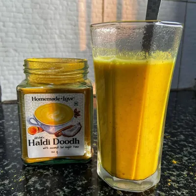 A glass of our Instant Haldi Doodh, or Golden Milk, ready to be enjoyed. We've blended traditional turmeric with hints of coconut and vanilla to create a comforting drink that's both healthy and delicious.