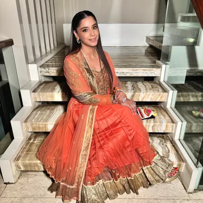 Suiting up for the festive season. A beautiful orange anarkali paired with sleek hair and glowing makeup for a Diwali party.