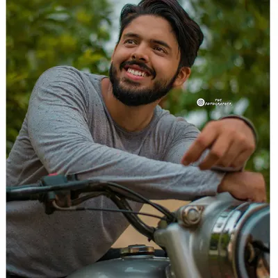 A great portrait is about capturing a feeling. This shot from a biker photoshoot focuses on the happiness and freedom associated with riding, highlighted by a natural, upward-looking smile.
