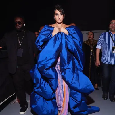 A backstage look at the incredible volume and artistry of a couture gown. My work involves managing these complex looks to ensure they are perfect from every angle, from the car to the red carpet.