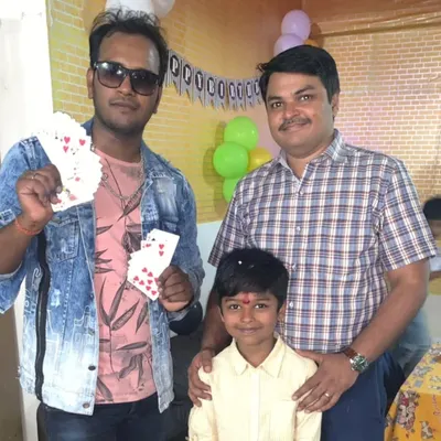 A happy family moment after a birthday party show. I love posing for photos with the guests and the birthday child, capturing the fun memories we created together with some card magic.
