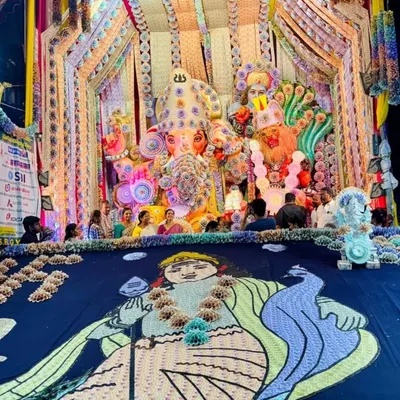 A full view of a spectacular Ganesh pandal decorated with art made from over two crore rupees in currency. This project showcases my ability to execute grand, thematic concepts for large community Ganeshotsav events.