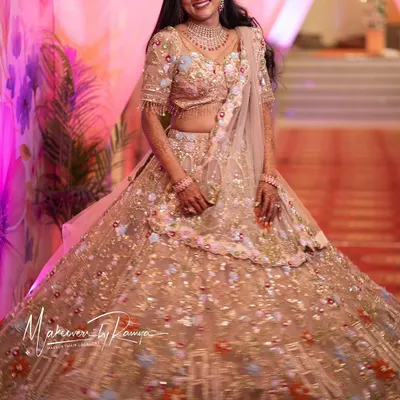 Jagruthi looked like a princess for her reception. Her intricately embroidered lehenga was complemented by long, flowing hair and makeup that made her glow.