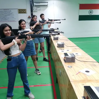 Smiles all around after a great session. It's awesome to see friends trying something new together and enjoying the challenge of target shooting.