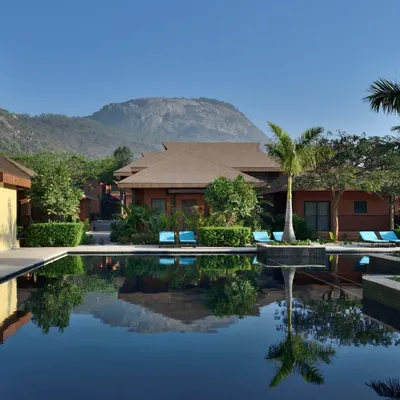 The reflection of the hills in the still water of our pool is a sight to behold. We designed this space to be a tranquil oasis, where the architecture blends seamlessly with the natural landscape for your complete serenity.