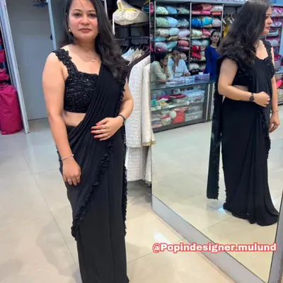 A full look at the stunning black ready-to-wear ruffled saree. The sequined blouse adds the perfect amount of sparkle, while the pre-draped style ensures a flawless silhouette.