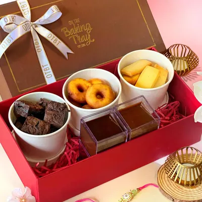 My Dunk'In DIY Hamper is all about having fun with your dessert. It comes with mini brownies, doughnuts, cookie sticks, and two delicious chocolate dips for you to get creative.