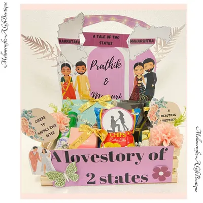 A love story of two states, told through a hamper. We designed this creative gift to celebrate a couple from Karnataka and Maharashtra, featuring custom caricatures and treats from both regions.
