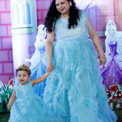 Feel like a fairy-tale princess and her queen. This client and her daughter are wearing my custom-designed blue ruffled gowns for a magical birthday party.