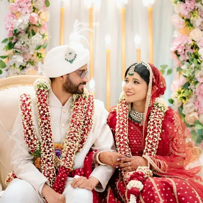 A beautiful candid moment between the bride and groom during their Nikah ceremony. The way they look at each other tells the whole story.