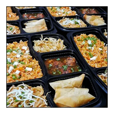 My Saturday Special Chinese food platters, all packed and ready to go. Each platter includes Schezwan Fried Rice, Veg Noodles, Veg Manchurian Gravy, and crispy Spring Rolls.