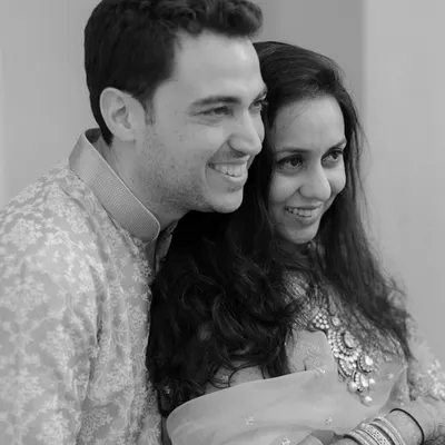 A simple, beautiful black and white portrait capturing the genuine smiles of a couple in love. This timeless style emphasizes emotion and connection above all else.