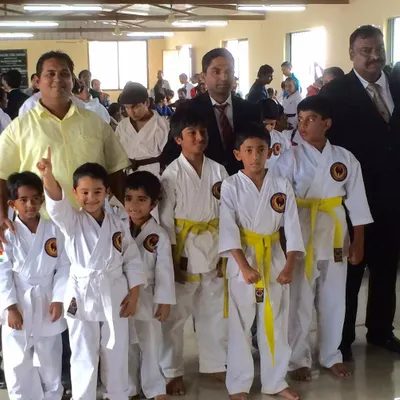 Posing with my youngest students and fellow officials. Guiding the next generation is a responsibility I hold with pride.