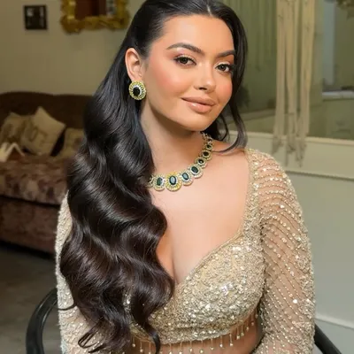 A close up of classic Hollywood waves. This style is all about shine, structure, and volume. I style each wave carefully to create this uniform, glamorous effect that is perfect for an evening event like a cocktail party.