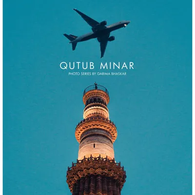 A perfectly timed shot of an airplane flying over the Qutub Minar at dusk. This photo series combines a modern element with a historic monument to create a unique and striking image of Delhi.