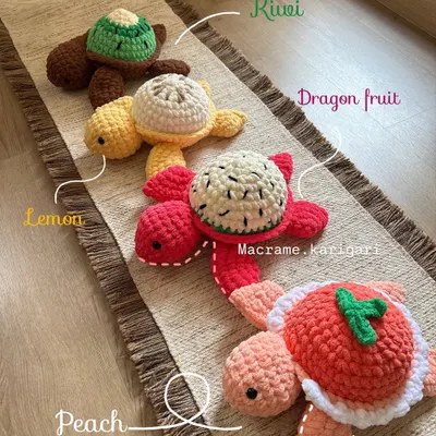 Our full fruit-themed turtle lineup. Here you can see the Kiwi, Lemon, Dragon Fruit, and Peach designs all together. Each shell is uniquely designed to look like a slice of fruit, making them a fun and quirky collectible.