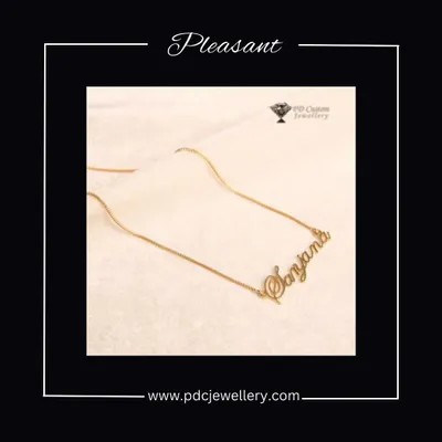 Get your own custom name chain. This image shows a "Sanjana" nameplate necklace in a beautiful script, a truly personal and pleasant gift.
